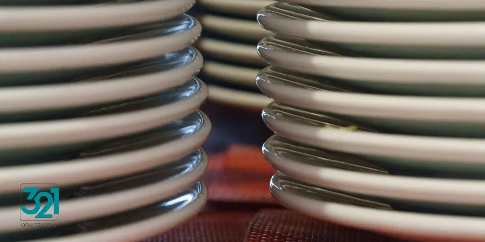White plates are stacked. Dining room at the hotel. Buffet. Lunch and relaxation concept.